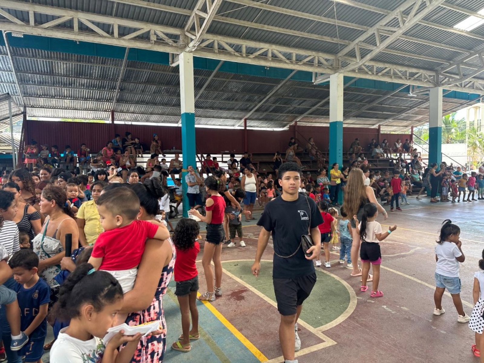 The covered court full of families