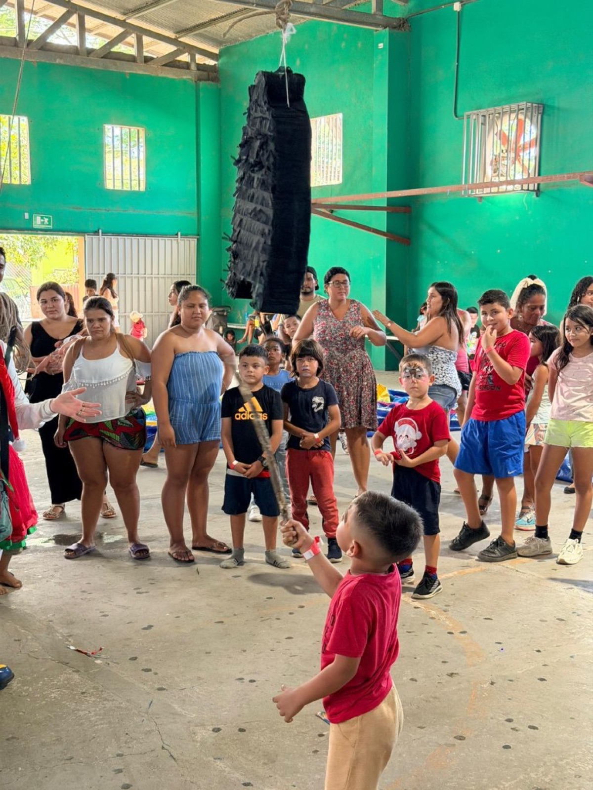 Piñata game at a Corazones Unidos event